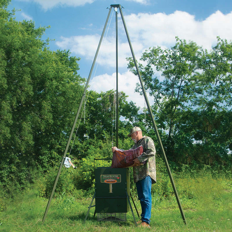 300lb Wildlife Trophy Feeder with EZ Lift Tripod System  being loaded with feed